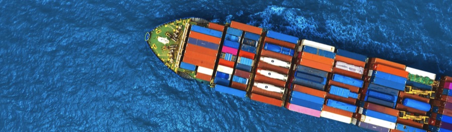 Container ship loaded with stacked shipping containers