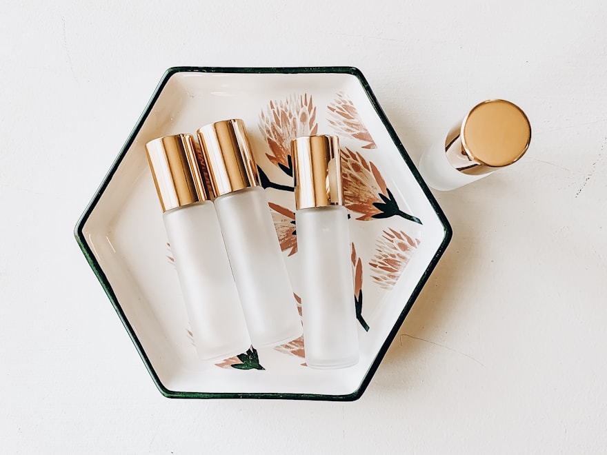 Glass roller bottles arranged on a light tray