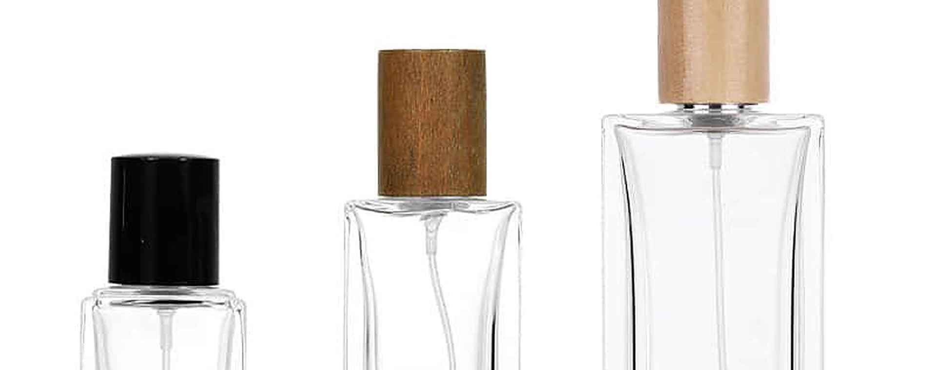 Glass perfume bottles with metallic collars and caps