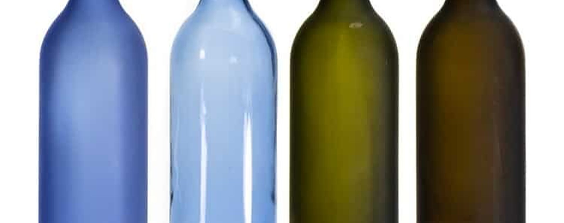 Bordeaux wine bottles in blue and antique green, empty, standing together