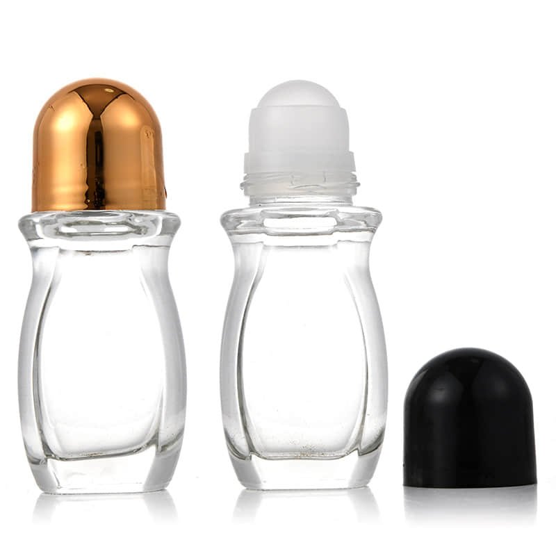 Two flat glass roller bottles with a gold and a black dome cap