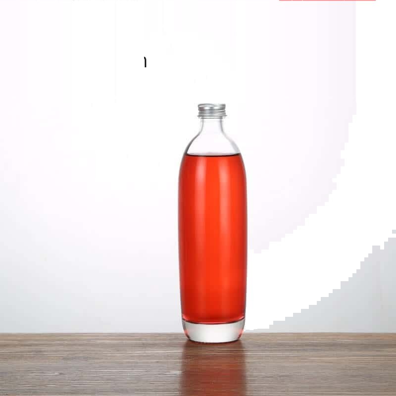 Runde Spirituosenflasche, 330 ml, gefüllt mit einer roséfarbenen Spirituose