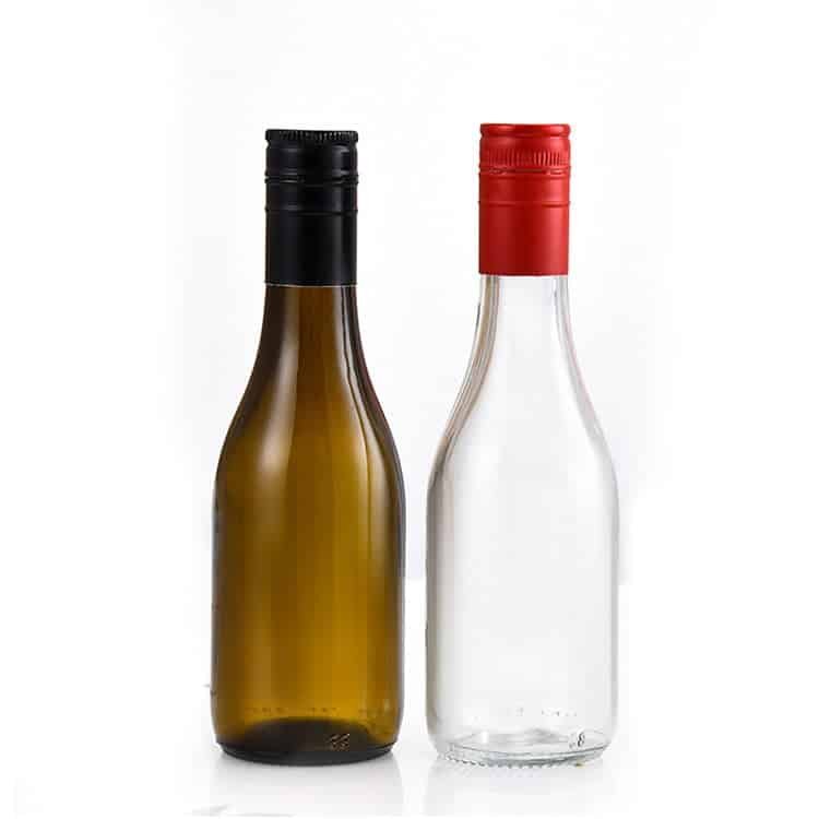 Burgundy wine bottles in amber and flint with coloured capsules