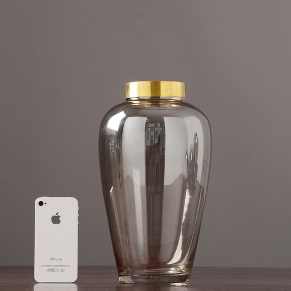 transparent glass vase with copper ring at mouth
